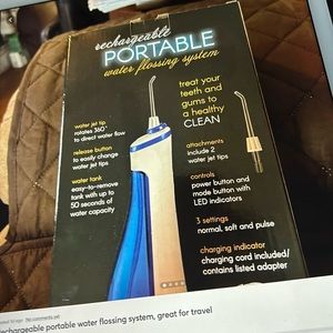 rechargeable portable water flossing system, great for travel, never used